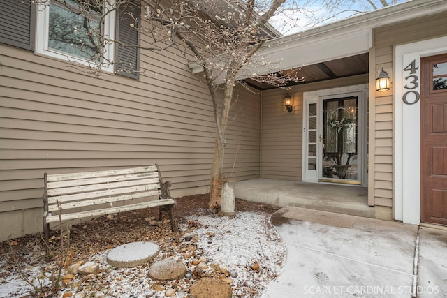 view of snow covered property entrance