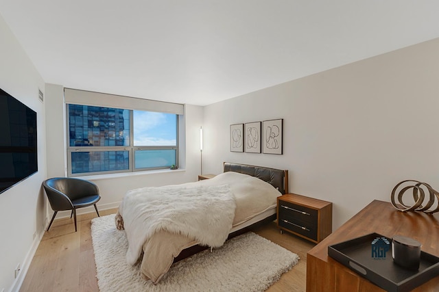 bedroom with light wood-type flooring