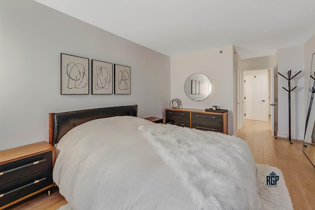 bedroom with light hardwood / wood-style floors