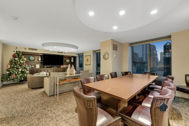 dining area with built in shelves and carpet floors