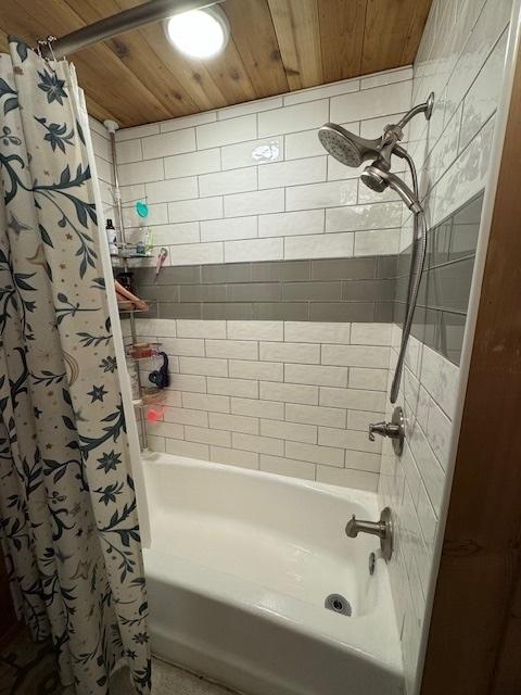 bathroom with shower / tub combo with curtain and wood ceiling