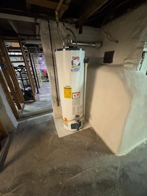 utility room with water heater