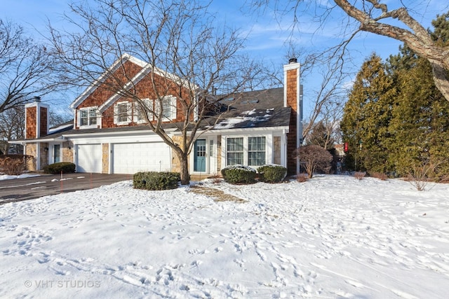 front of property with a garage