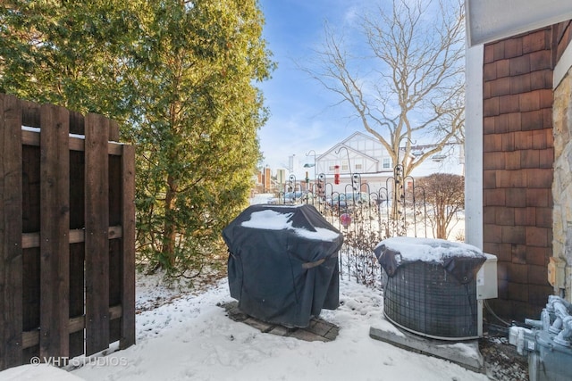 exterior space featuring central AC and a grill