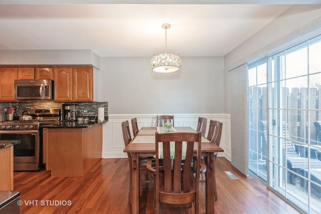 dining room with dark hardwood / wood-style floors