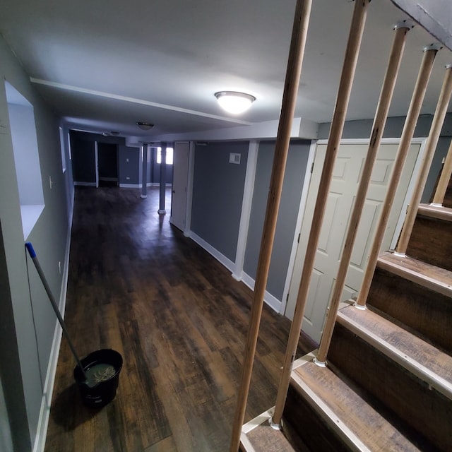 corridor with dark wood-type flooring