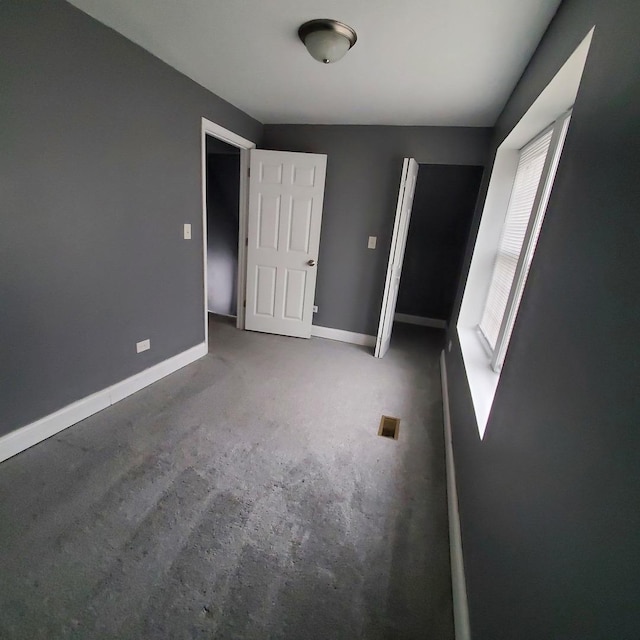 unfurnished bedroom featuring carpet flooring