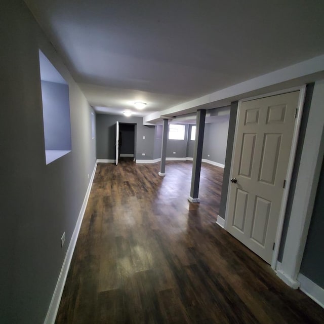 basement with dark hardwood / wood-style flooring