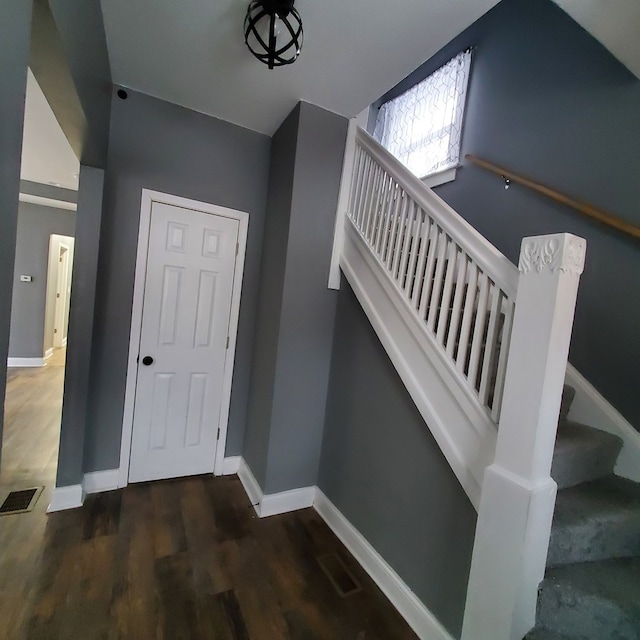 stairway featuring hardwood / wood-style floors