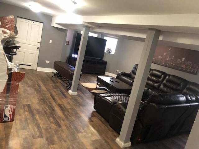 living room with dark hardwood / wood-style flooring