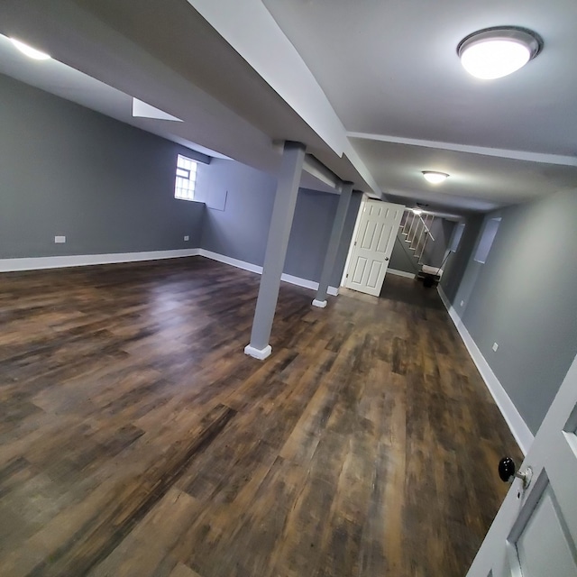 basement with dark wood-type flooring