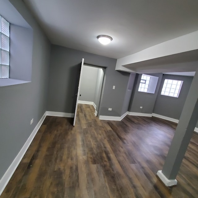 basement featuring dark hardwood / wood-style flooring