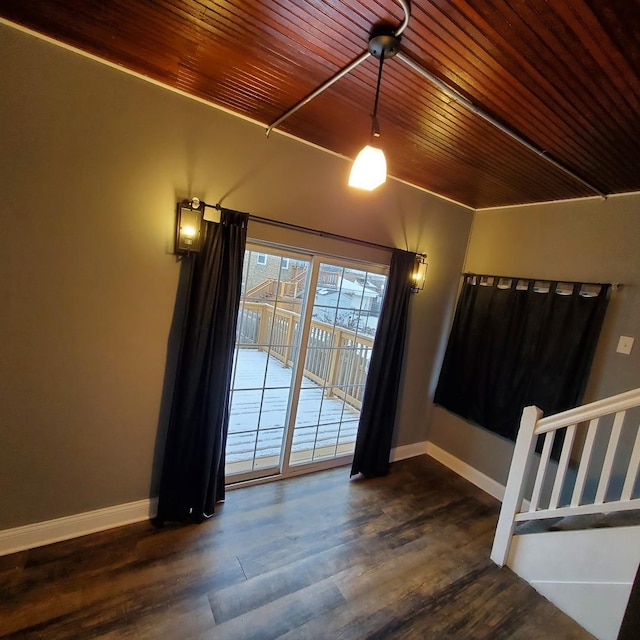 spare room with wooden ceiling and dark wood-type flooring