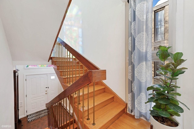 stairs with hardwood / wood-style floors