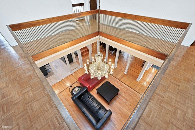 living room with parquet floors and a chandelier