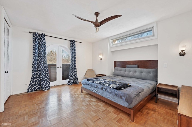 bedroom with light parquet flooring, a closet, ceiling fan, and french doors