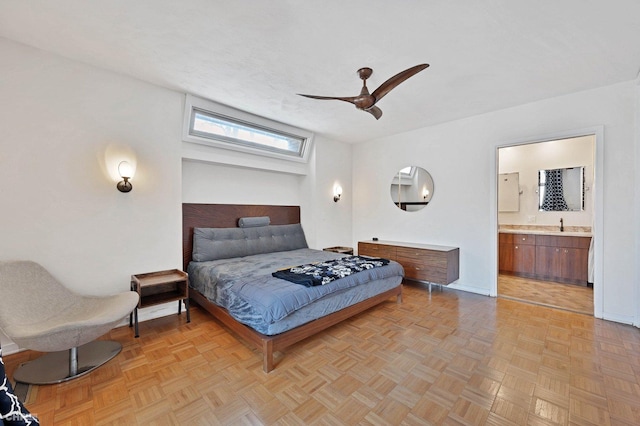 bedroom featuring light parquet floors, sink, connected bathroom, and ceiling fan