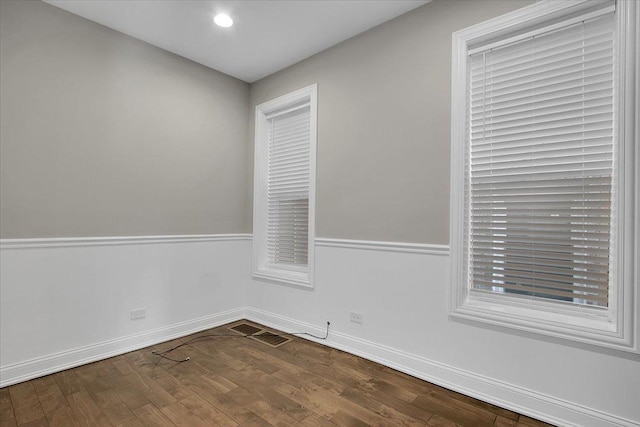 empty room with hardwood / wood-style floors