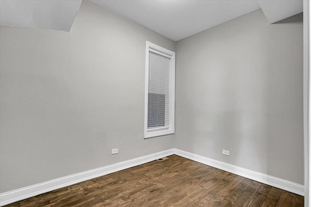 spare room with hardwood / wood-style floors