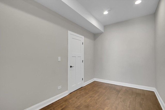 unfurnished room with hardwood / wood-style floors