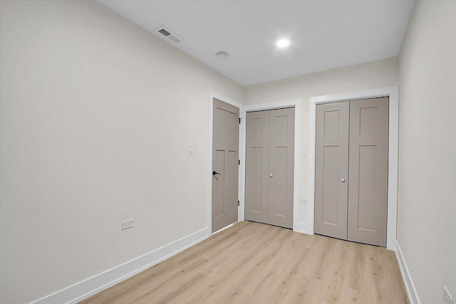 unfurnished bedroom with light hardwood / wood-style floors