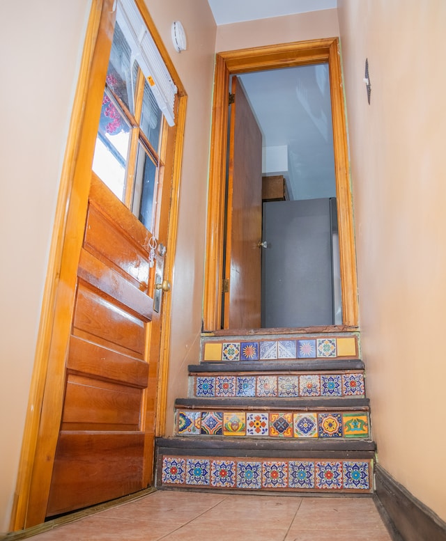 stairs with tile patterned flooring