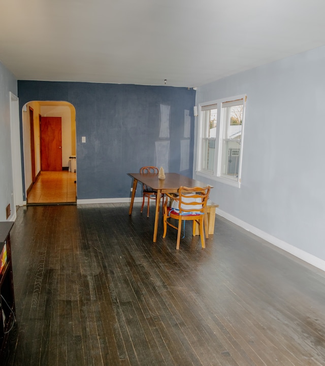 dining room with dark hardwood / wood-style floors