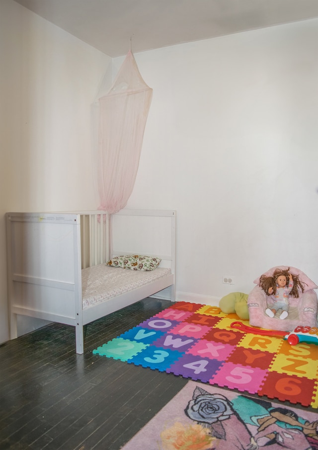 bedroom featuring hardwood / wood-style flooring