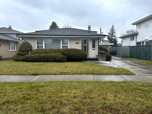 view of front of property featuring cooling unit and a front lawn