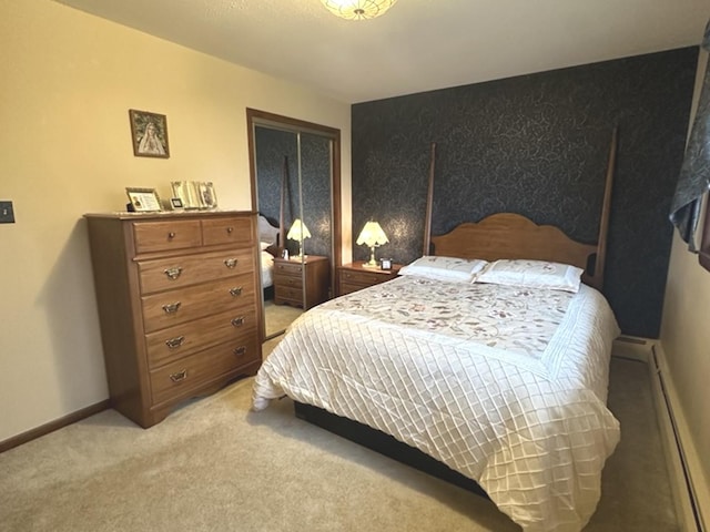 bedroom with light colored carpet and baseboard heating