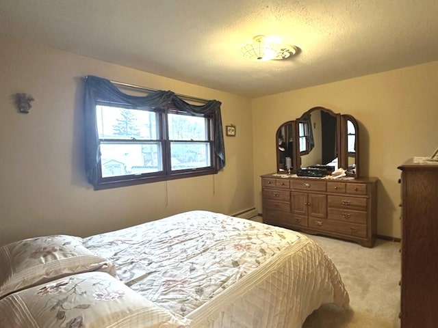 carpeted bedroom featuring a textured ceiling and baseboard heating