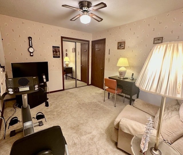 carpeted living room with ceiling fan