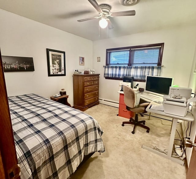 carpeted bedroom with ceiling fan and a baseboard heating unit