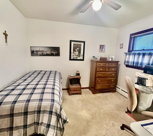 bedroom with light carpet, ceiling fan, and a baseboard heating unit