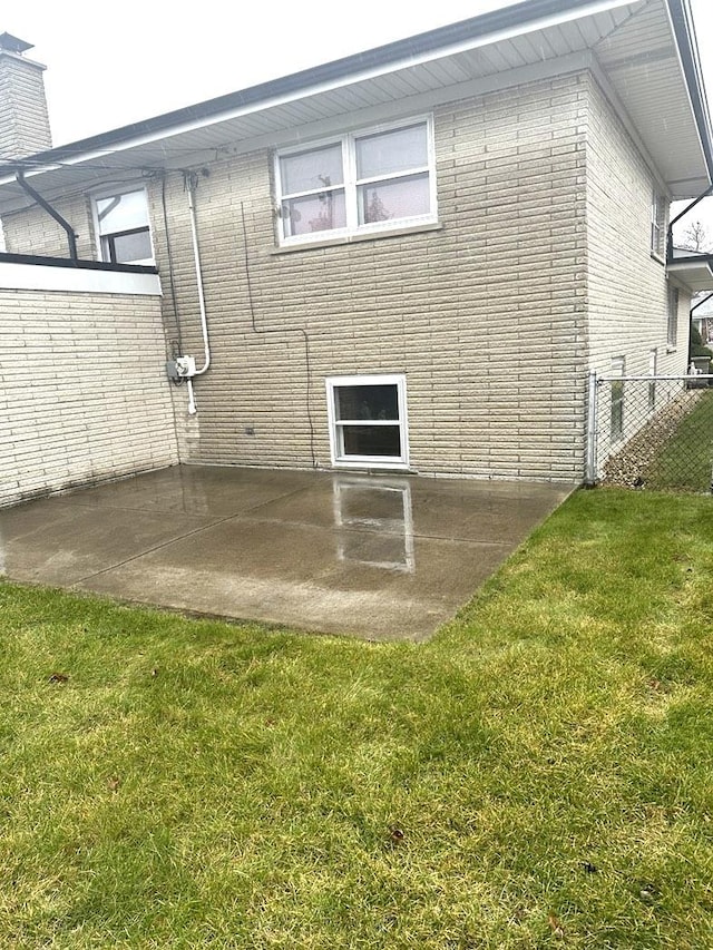 exterior space featuring a yard and a patio area