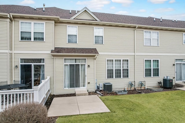 back of house featuring a yard, a patio area, and central air condition unit