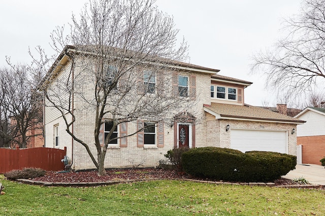 view of front of property featuring a garage, brick siding, a front yard, and fence