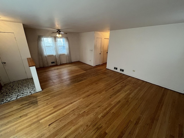 spare room featuring ceiling fan and wood-type flooring