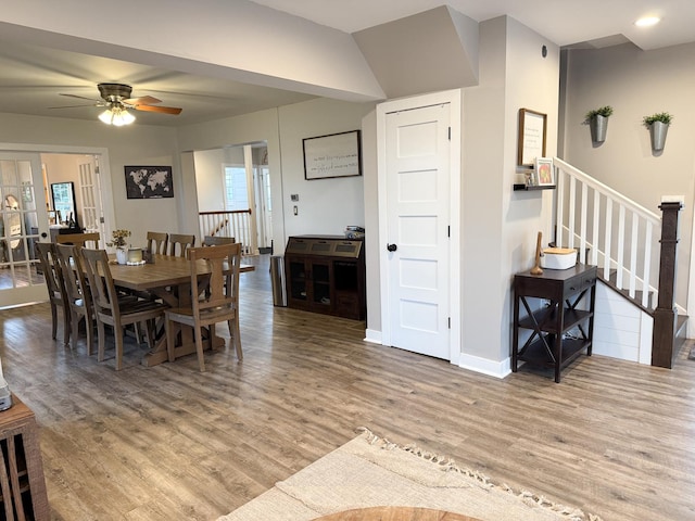 dining space featuring light hardwood / wood-style floors and ceiling fan