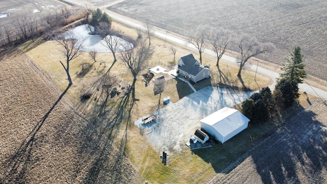 birds eye view of property with a rural view