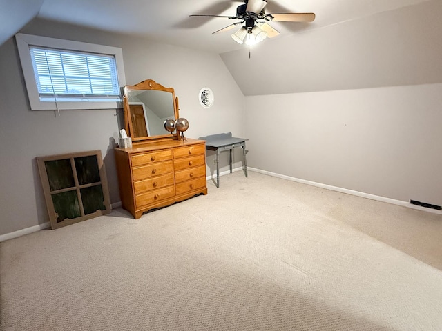 bonus room featuring ceiling fan, lofted ceiling, and carpet