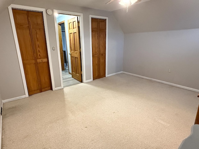 additional living space with lofted ceiling, carpet floors, and ceiling fan