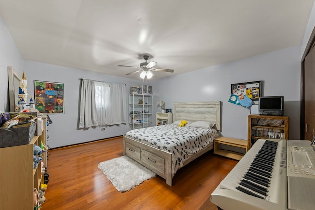 bedroom featuring ceiling fan and hardwood / wood-style floors