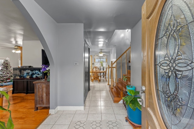 corridor featuring light tile patterned floors