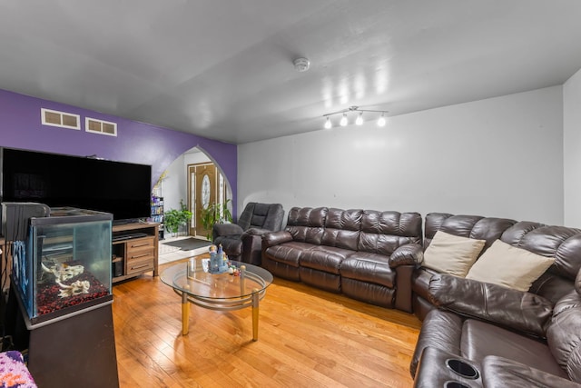 living room featuring french doors and hardwood / wood-style flooring