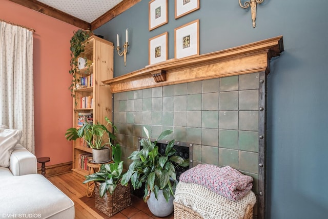 interior space featuring hardwood / wood-style flooring and crown molding