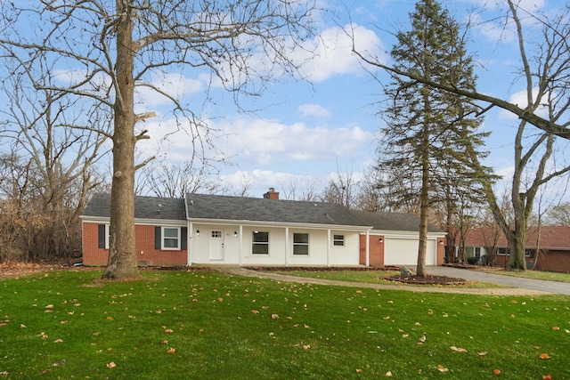 single story home featuring a front yard and a garage