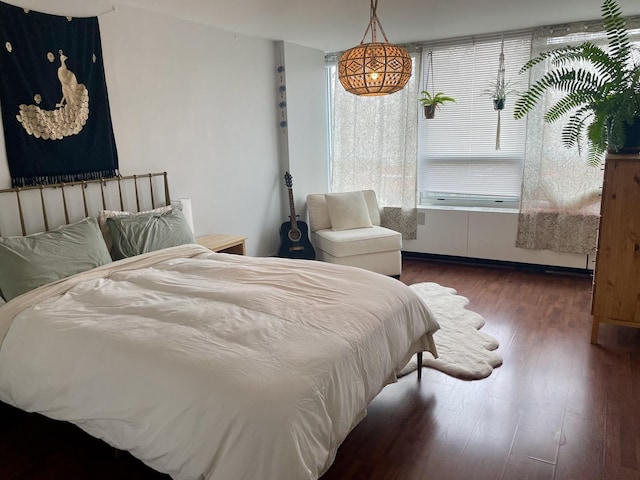 bedroom featuring dark hardwood / wood-style flooring