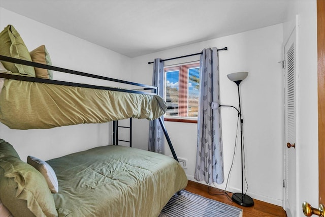 bedroom with hardwood / wood-style floors