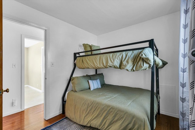 bedroom with wood-type flooring